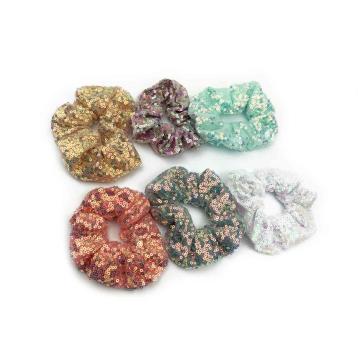 Fermacoda tessuto con paillettes