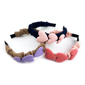 Cerchietto tessuto arricciato con cuori
