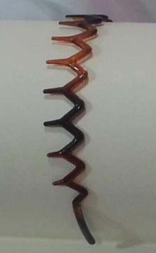 Cerchietto con denti demi 100% plastica